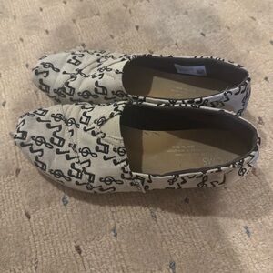 Toms Black and White Striped Slip-Ons